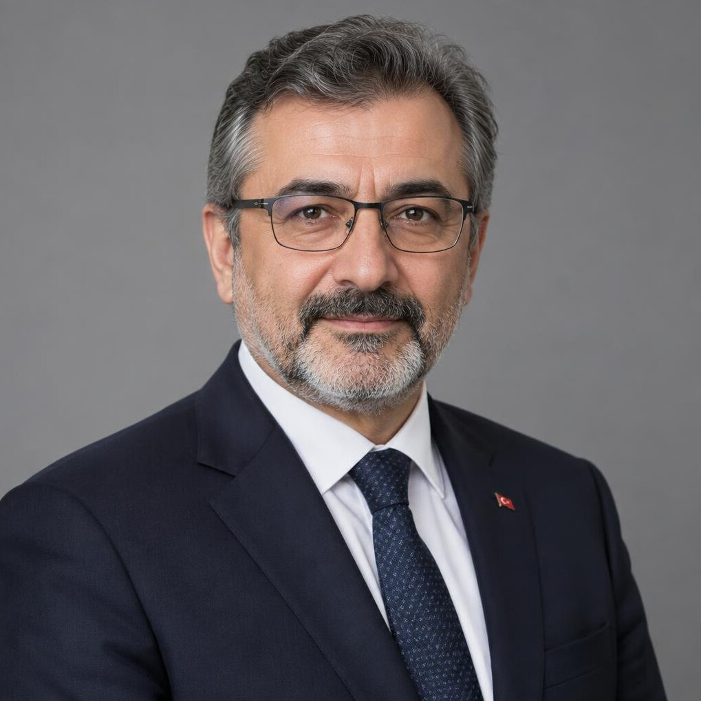 Turkish man in his 50s with glasses in a suit